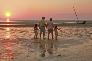 Family walking on Crosby beach in Brewster